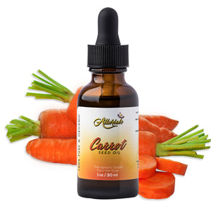  A bottle of carrot oil placed in front of several carrots and a white background. 