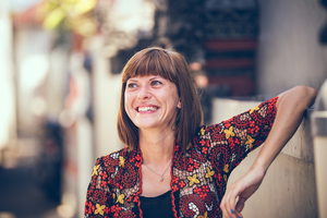 A smiling middle-age woman